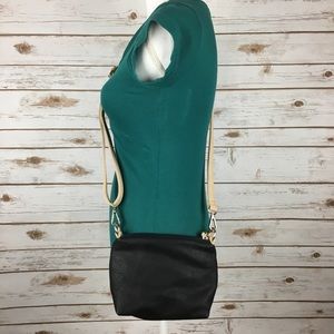 Charming Charlie black and tan crossbody purse