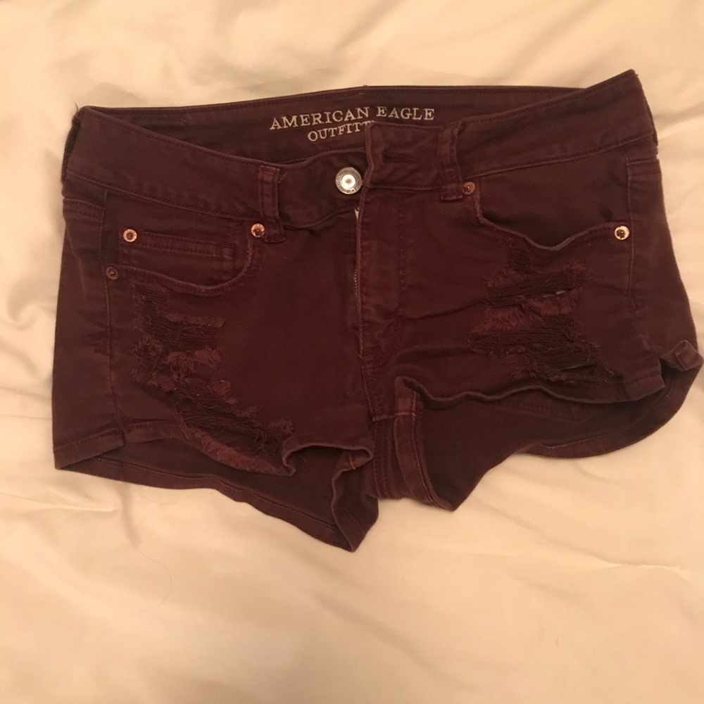 Destroyed Maroon Shortie Denim Shorts from AEO