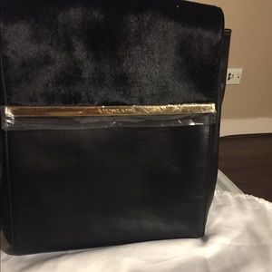 Black leather and faux fur Michael Kors backpack
