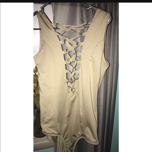 Open, crisscross ribbon body suit
