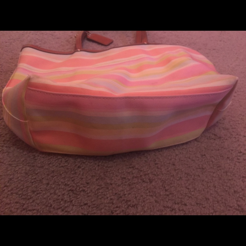 Authentic striped  coach purse .