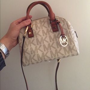 small MK bag ! Over the shoulder or hand held