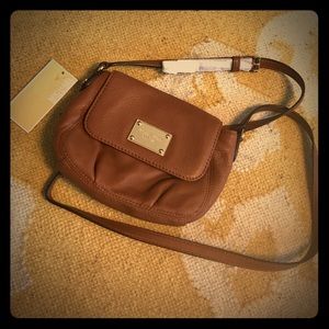 Cute cross body Michael Kors bag.