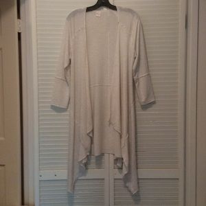 Soft cream colored throw on cardigan