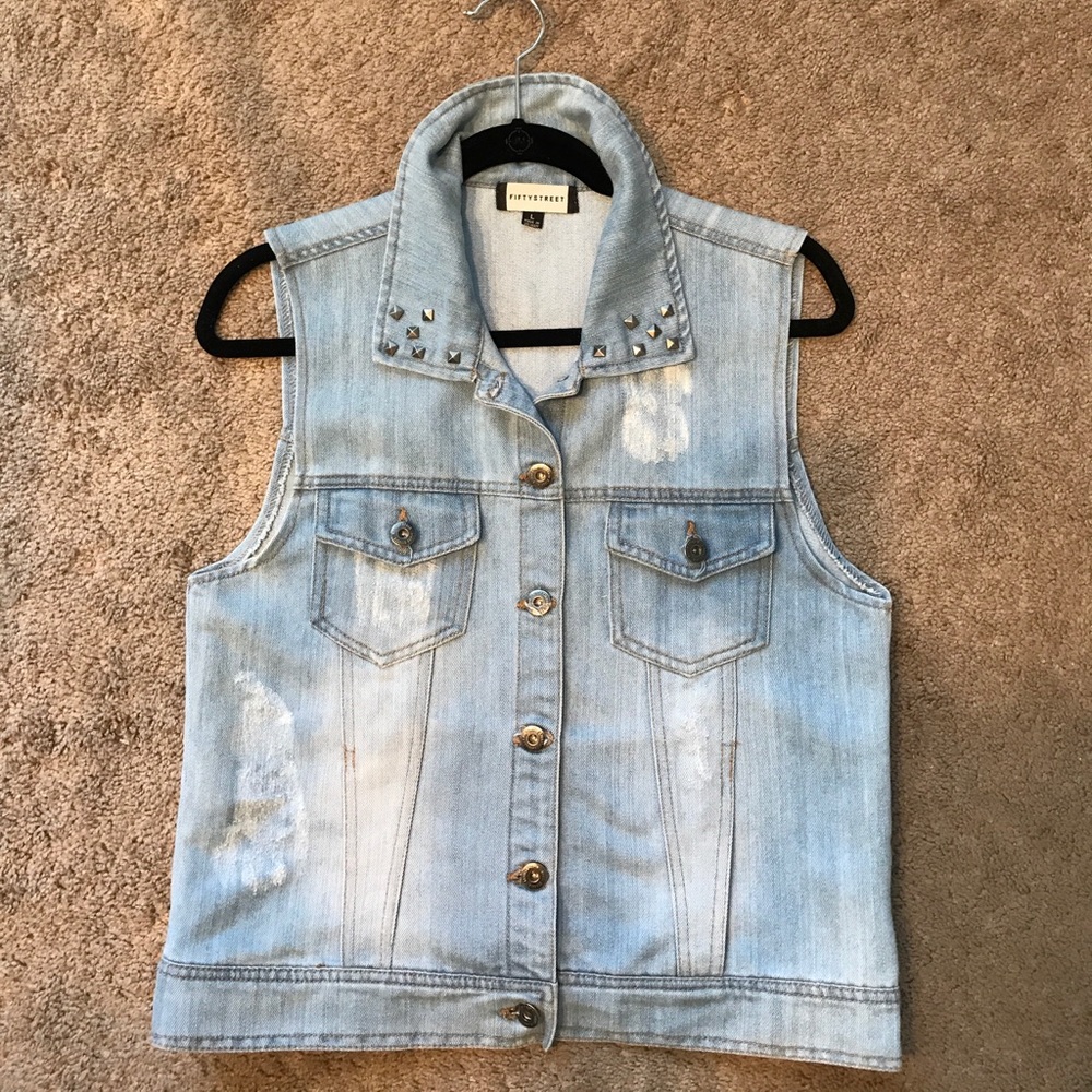 Light wash denim vest with studs