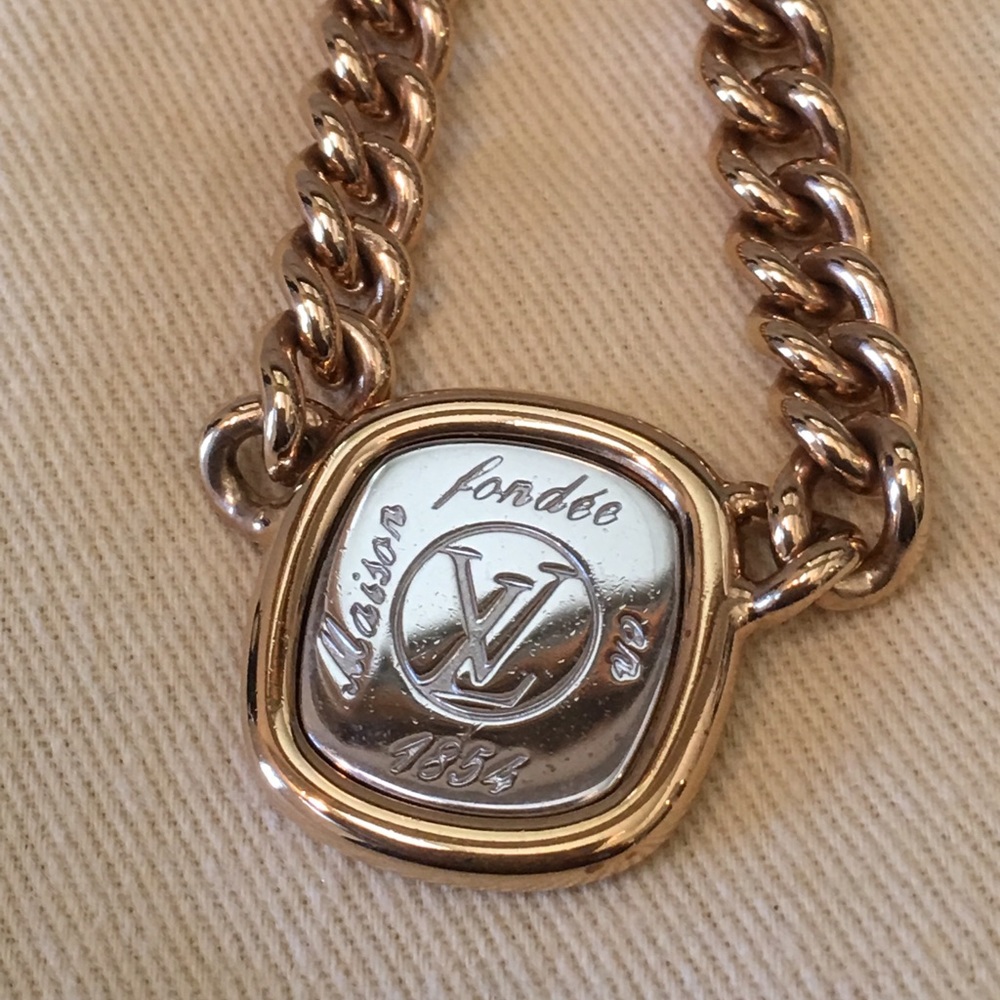 Louis Vuitton signature necklace.