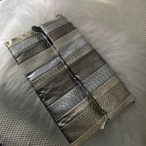 Gold silver and bronze clutch