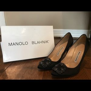 Fabulous Manolo Blahnik Hangisi black satin pumps.