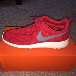Men’s red Nike tennis shoes
