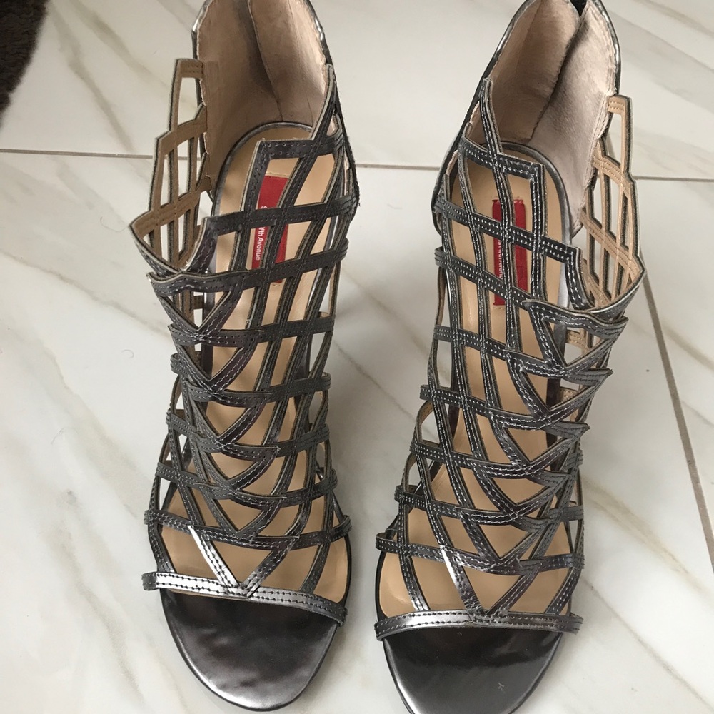 Gently used Red by Saks Fifth Avenue caged heel.