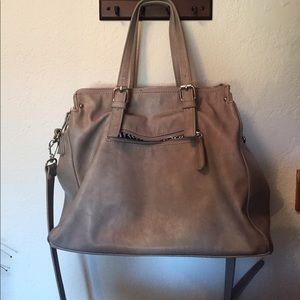 Gray purse with cross body strap
