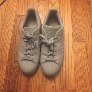Gray and silver adidas superstars