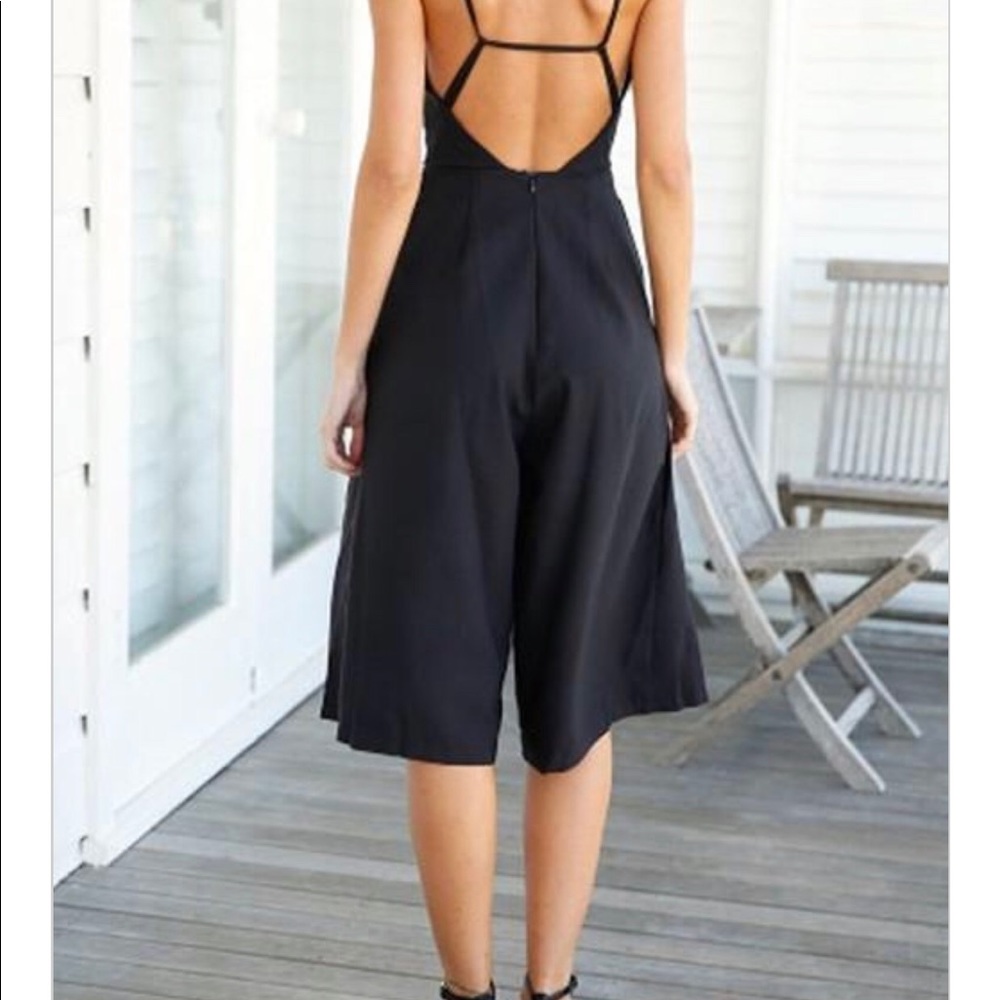 New Black backless Jumper.  Fits too small on me.