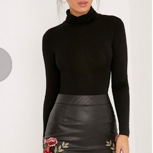 Black turtleneck bodysuit