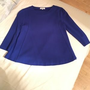 Great work top with a flirty flared silhouette