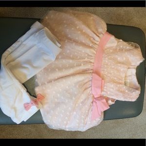 Baby pink dress with white leggings and bow detail