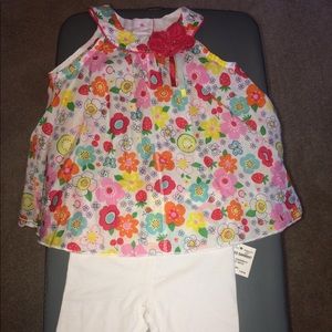 Sleeveless floral dress with matching leggings.