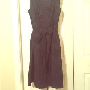 Black, knee-length sleeveless A-line classic dress