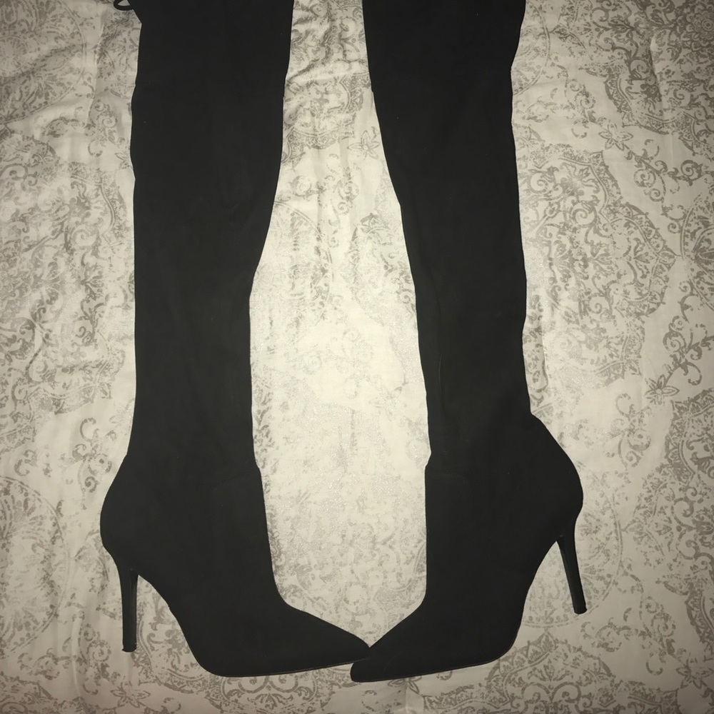 Thigh high suede black boots from Aldo.
