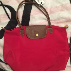 Long champ not real purse- never been used