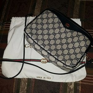Gucci cross body purse.  Petite.  Approx 8"x6"x2"