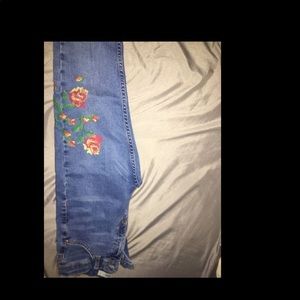 Topshop trendy jeans with flower patches on them