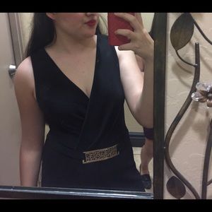 Black romper with gold belt attached. ✨