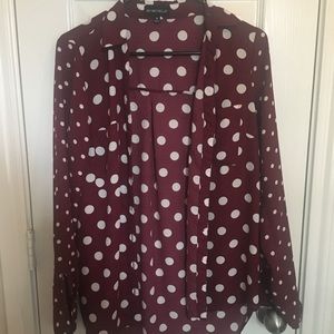 Maroon long sleeve blouse with white polka dots.
