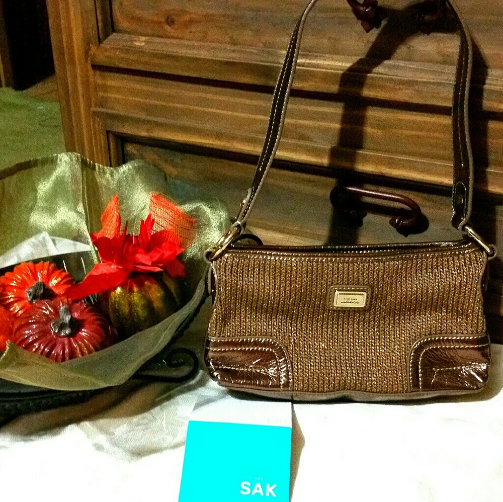 bronze color/ bronze metallic trim Sak bag. NWOT