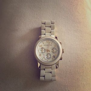 White Michael Kors watch with gold hardware