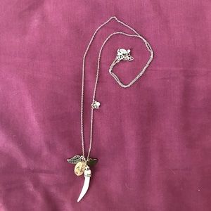 Necklace with ivory tusk-like charm
