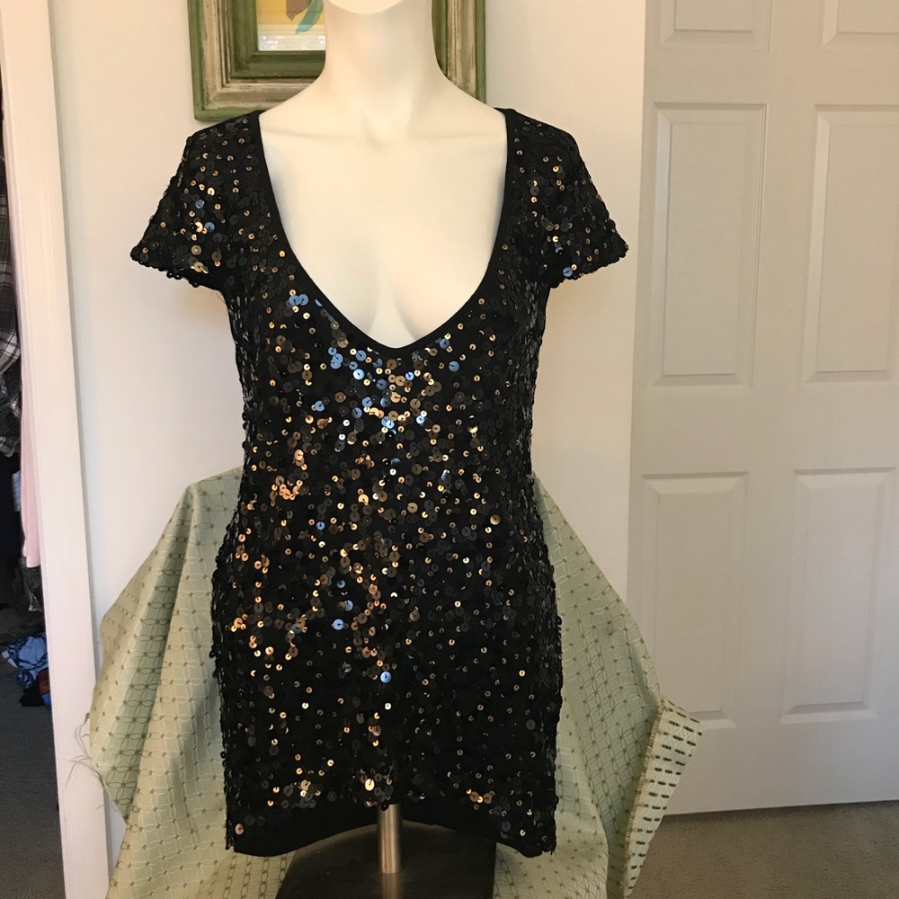 Orange/black sequined top