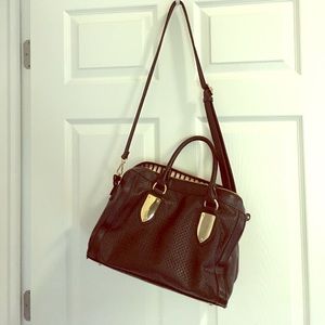 Leather purse with gold detail.