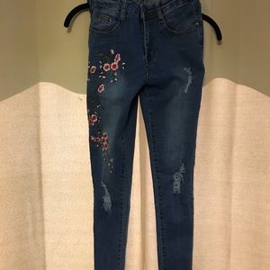 Floral embroidered jeans with destroyed hem