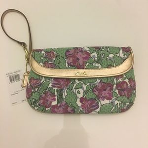 Coach, multi colored floral large wristlet