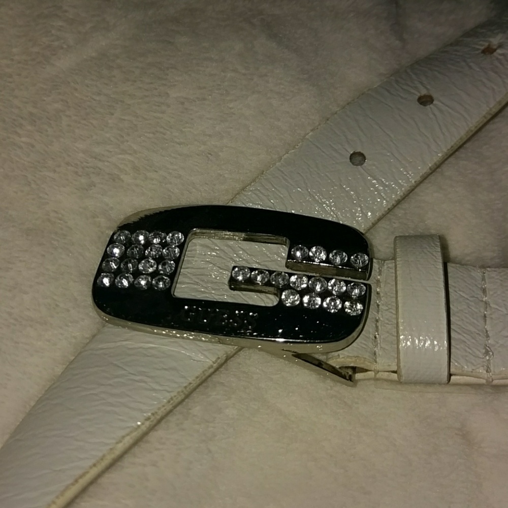 Guess white man made leather belt.