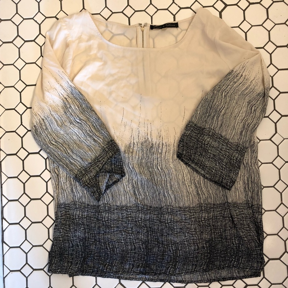 Sheer black and white blouse.