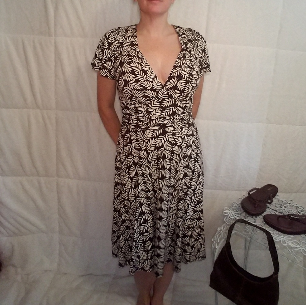 Brown v-neck dress with cream Leafs throughout