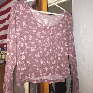 A cropped flower print long sleeve shirt