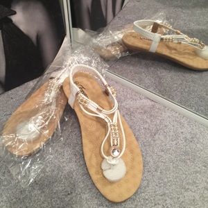 Never worn white with gold accents sandals.