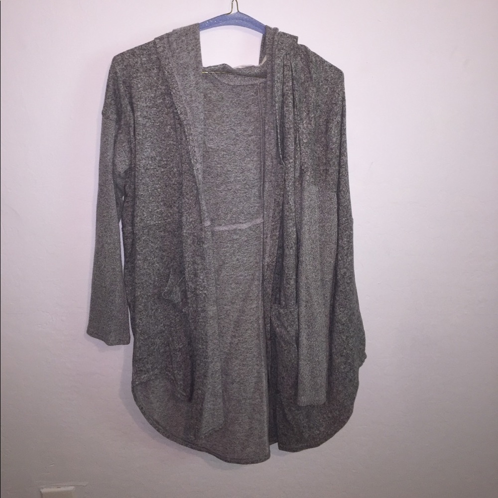 Out from under grey sweater