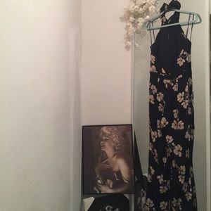 A one piece royal blue floral pants suit