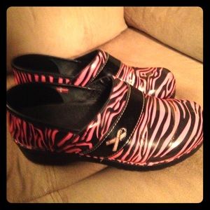 Pink and black zebra print clogs