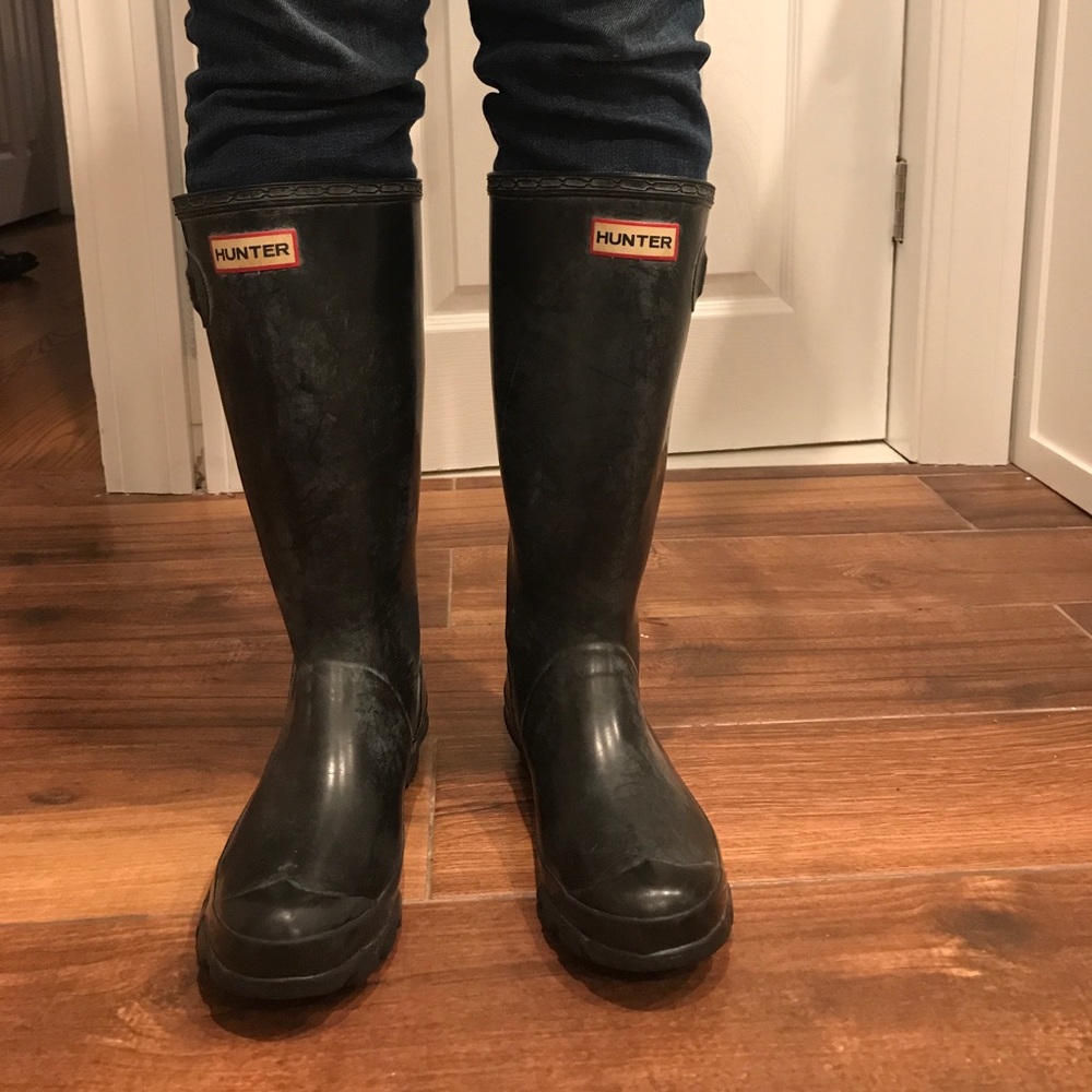 Distressed black Hunter rain boots. Lightly worn