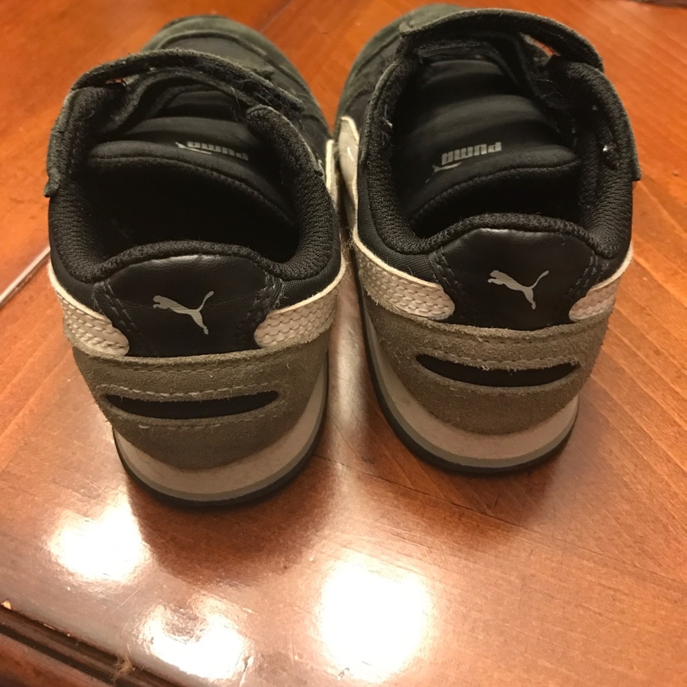 Puma black tennis shoes with grey and white accent