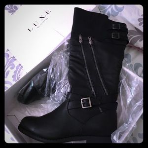 Black boots with silver zippers