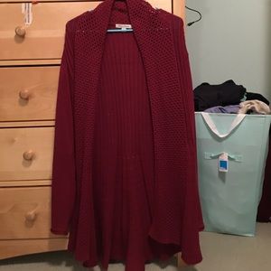 A maroon long studio works sweater