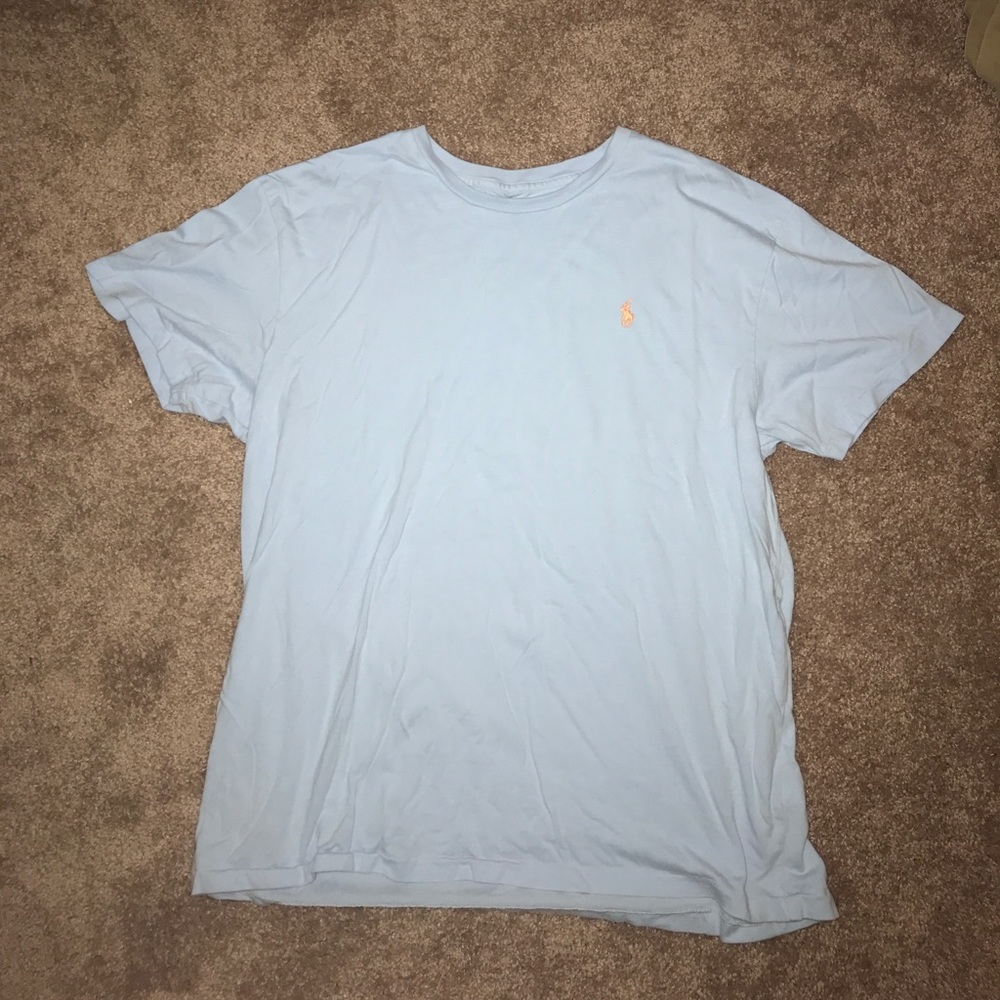 Light blue polo t shirt with orange logo