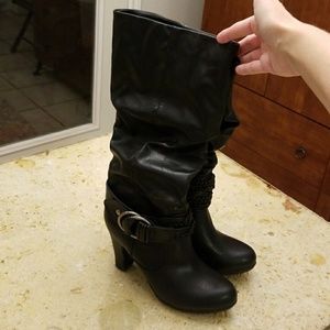 Knee high black heeled boots