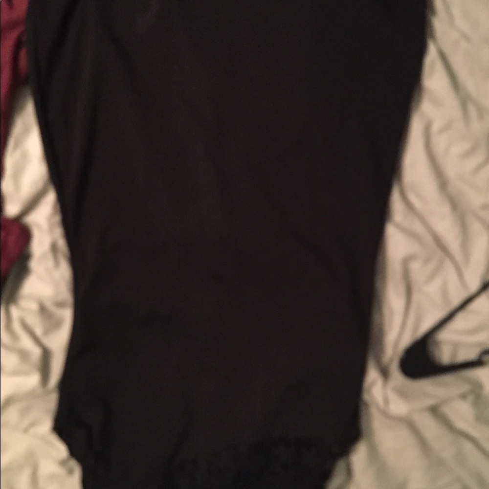 Black dress, with lace around the shoulder area.